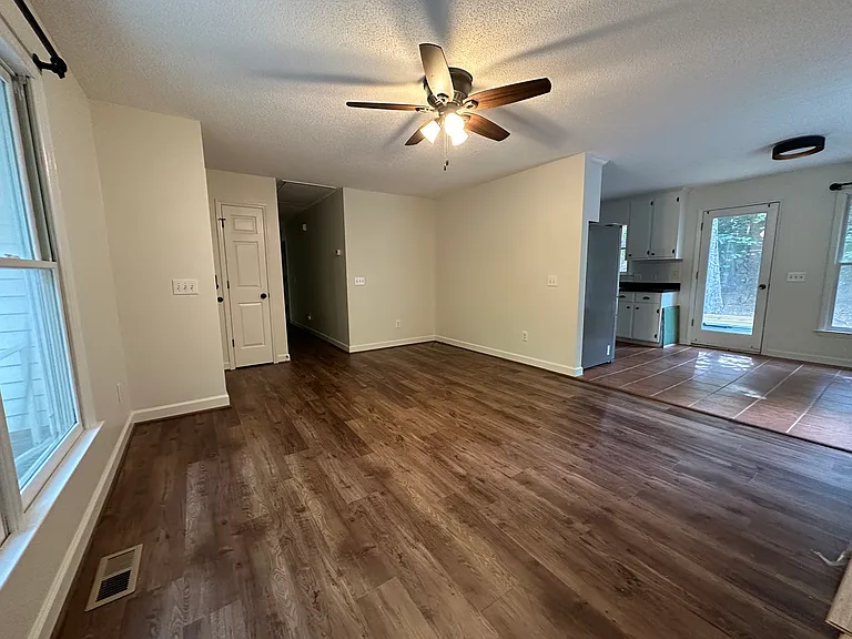 living room into the kitchen dining area