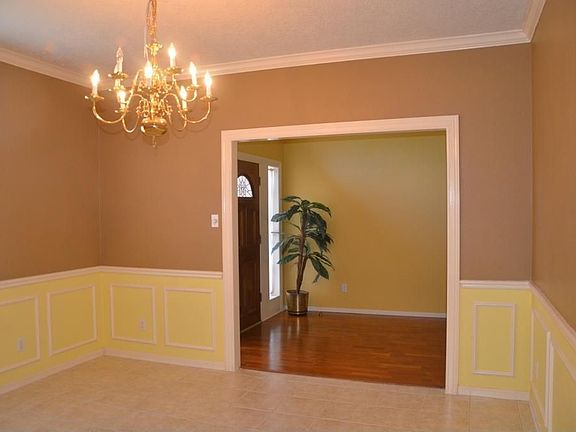 Formal dining room with chair rails.