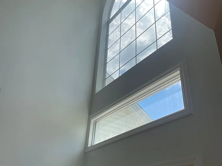 Vaulted ceiling entryway with large bright window