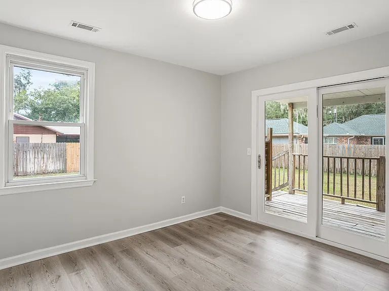 Bedroom # 3 w/ sliding glass door to covered deck