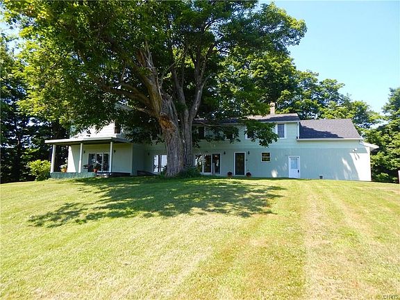 Side view of house (the door with the plants on either side enters into the mudroom)