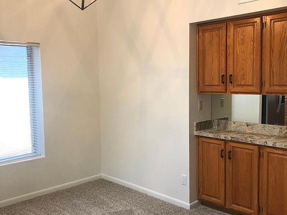 dining area with built in granite buffet and pantry