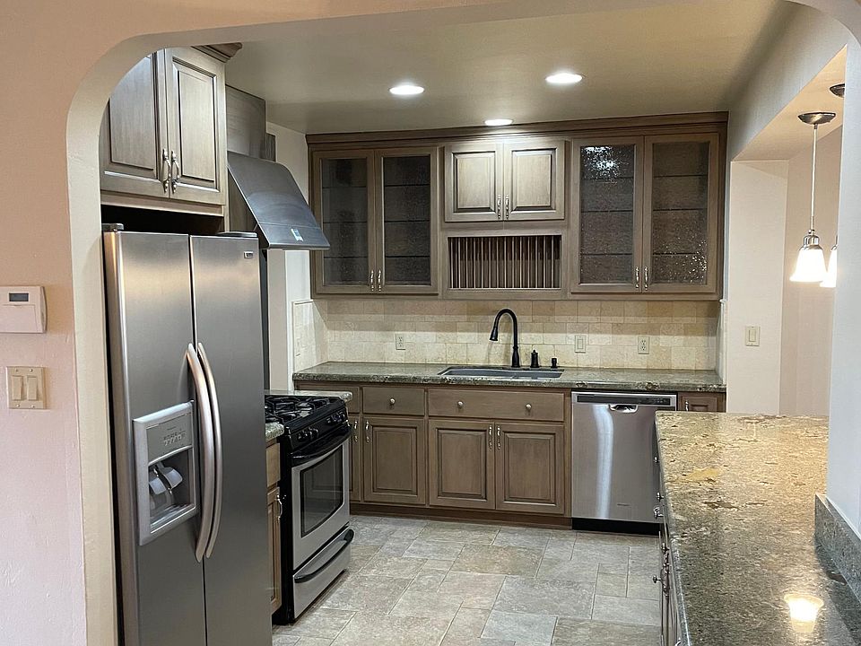 The kitchen offers a new dishwasher, gas range, and plenty of space for cooking and entertaining.