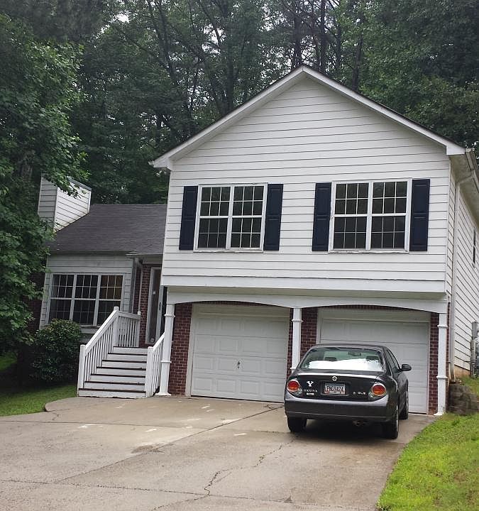 Front of home. Home is set back further from the road than most homes and has a very long driveway.