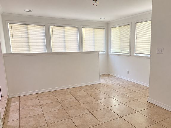 Sunroom and stairs to basement