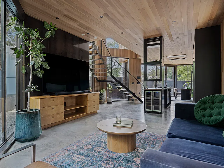 Floor to ceiling accordion windows throughout the space.