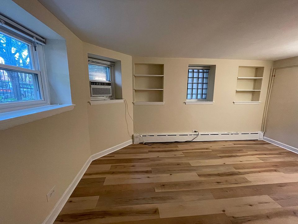 Large bedroom with built-in shelves and huge walk-in closet.