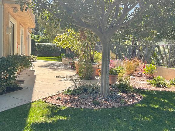 Lush landscaped large yard and side yards with lots of private areas for mediating and enjoying morning coffee in the courtyard.