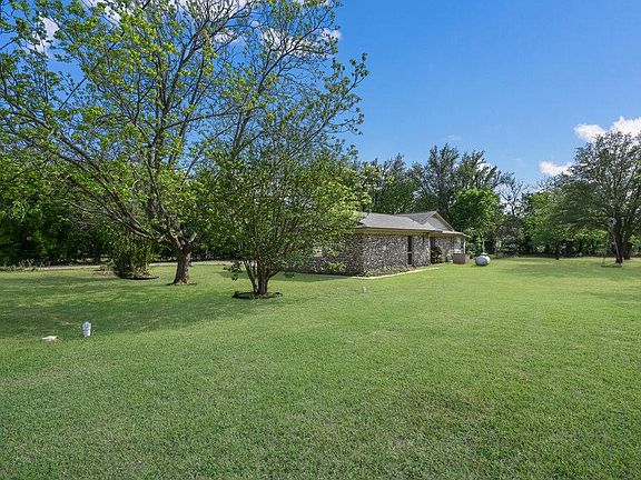 Front and side yard. Tree shaded backyard. .68 acre lot.
