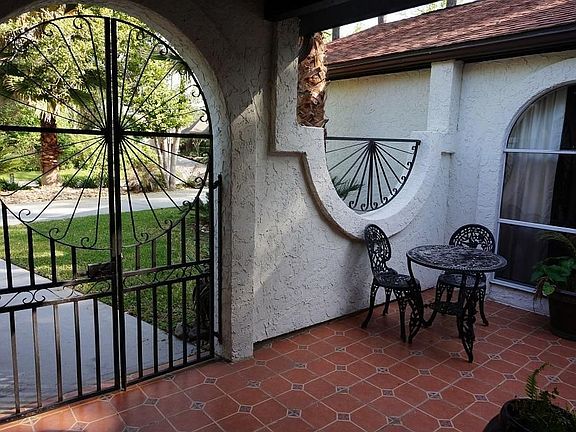 IRON GATE LEADING TO FRONT COURTYARD