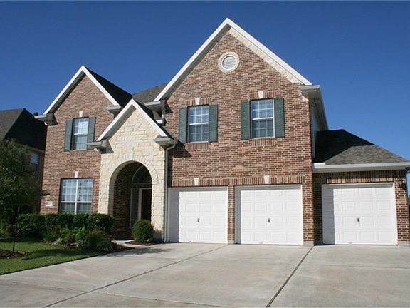 with 3 car attached garage