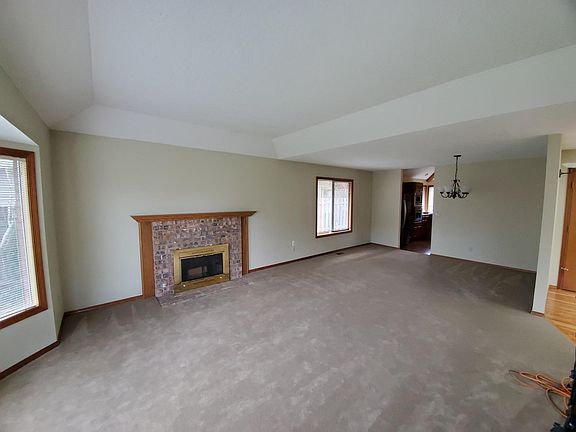 Large Living and Dining room with Bay front window.