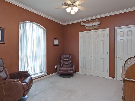 This study has french double doors and could also be a 5th bedroom. The doorway to the right leads to a full bath!