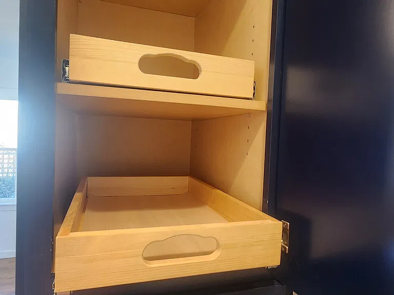 Shelf drawers in the kitchen cabinets for easy access