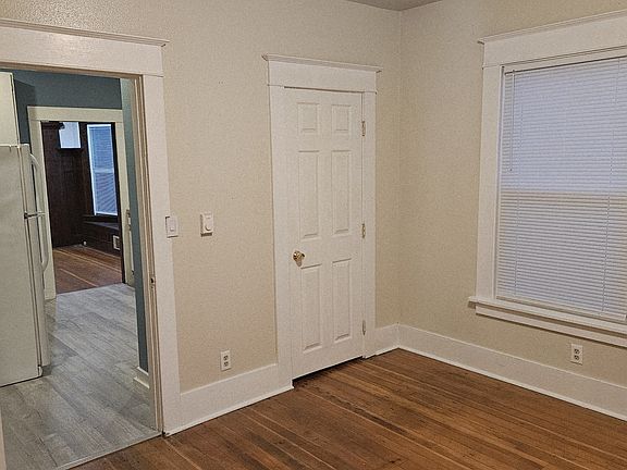 From bedroom facing front through kitchen to living room.