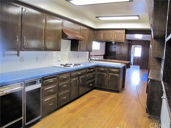 galley kitchen with plentiful cabinets and counter space