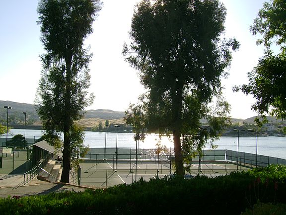 Steps to the tennis court and lake!      