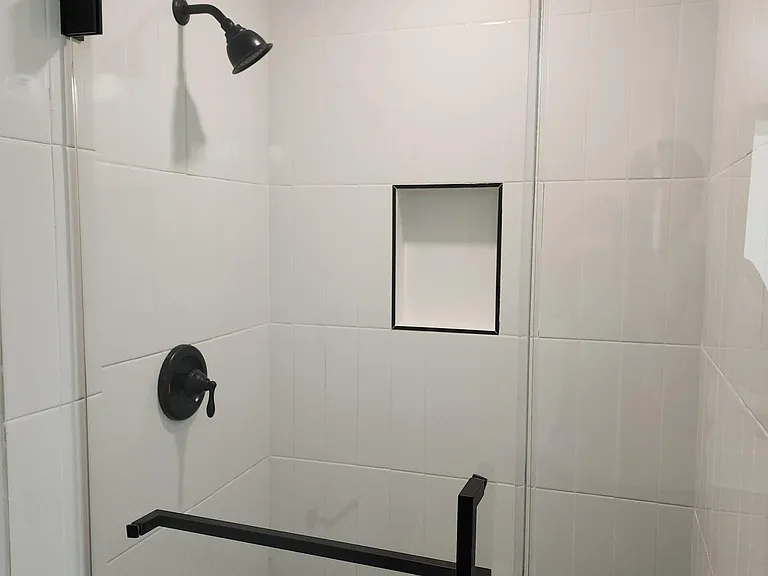 Guest bathroom with custom tiled shower