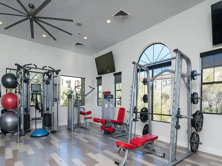24-Hour Gym with Strength Training Machines and Large Windows
