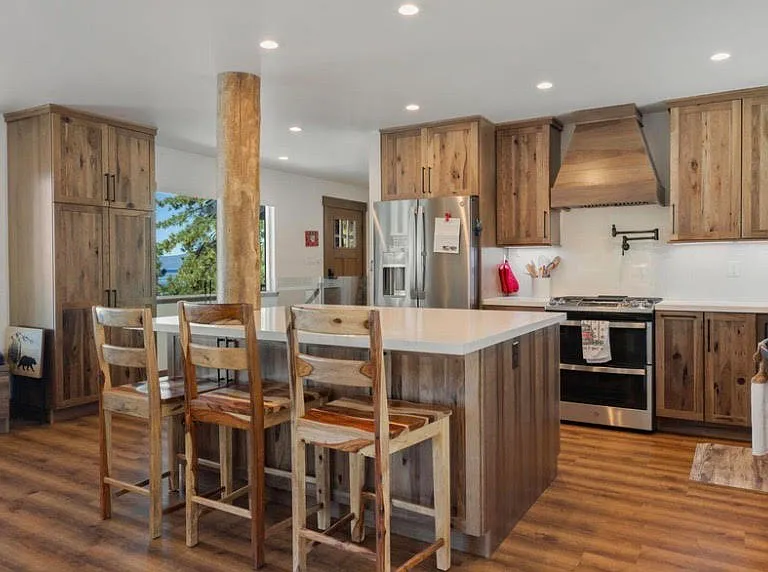 Open-concept kitchen with many extra conveniences and modern storage features; new appliances