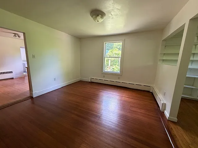 Dining room. To the right is the office nook. To the left is the kitchen.