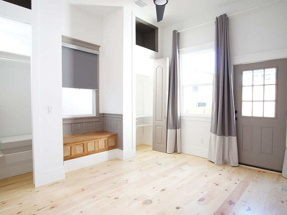 Bedroom with 2 closets and window seat. Exit to private deck in the back and courtyard.