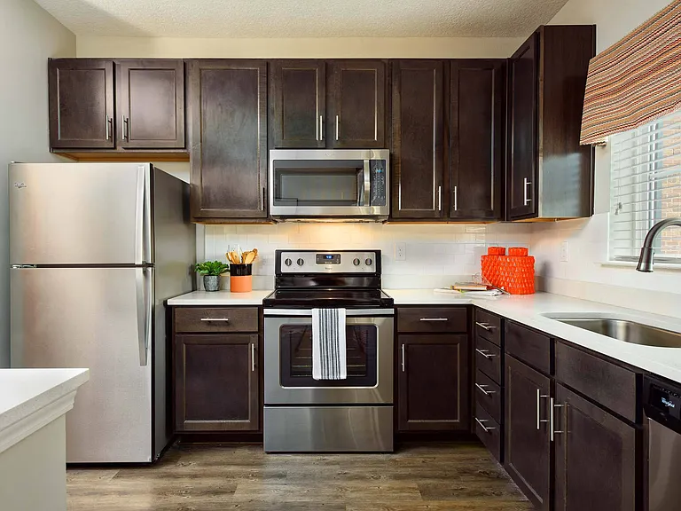 Kitchen with Stainless Steel Appliances & Quartz Countertops