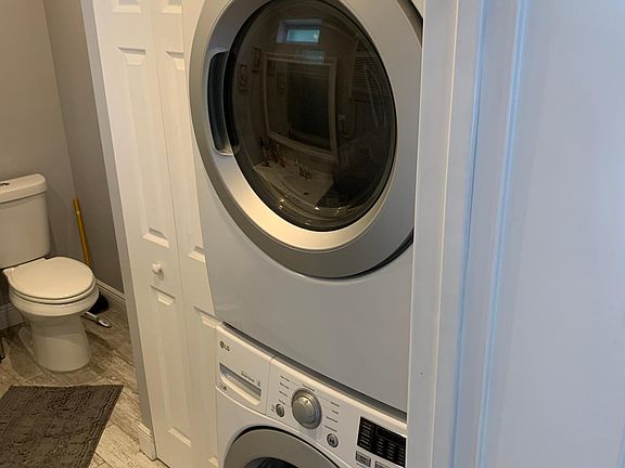 New washer and dryer inside unit.