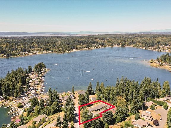 Drone view of property and lake