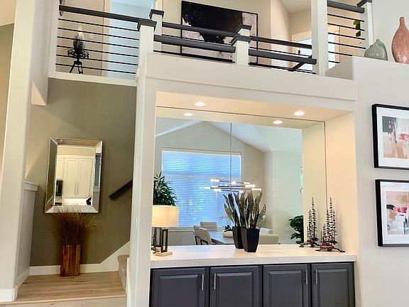 View of staircase and bar from the dining room