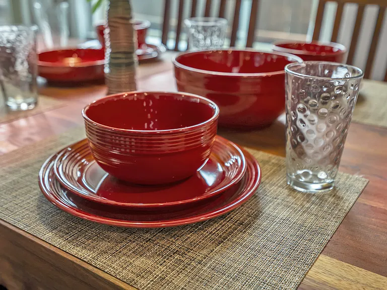All serving dishes, place settings for 8, with prep tools, pots, and pans are included