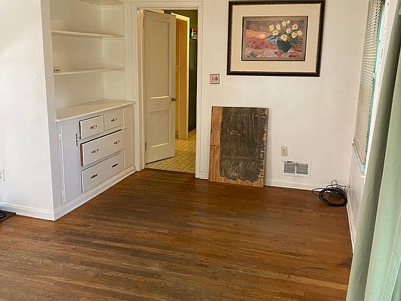 Dining area with built in cabinets/storage.
