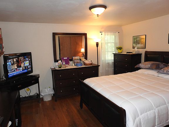 Main bedroom, on first floor, facing front porch, trees and street street. Has only AC in the house.