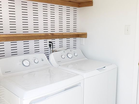 Newly renovated laundry room off the kitchen/living space.