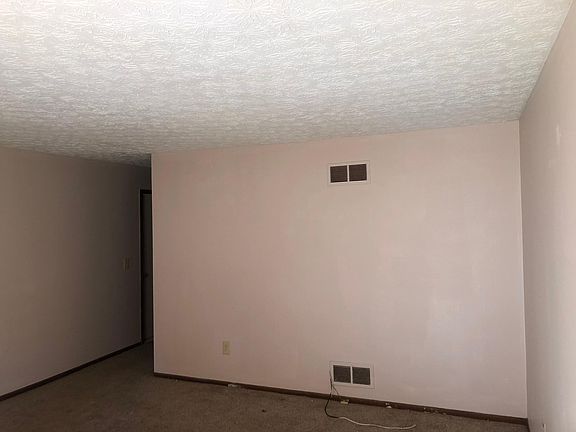 Living room with hallway to two bedrooms two room bath & kitchen