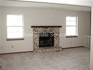 Living Room w/wood-burning fireplace