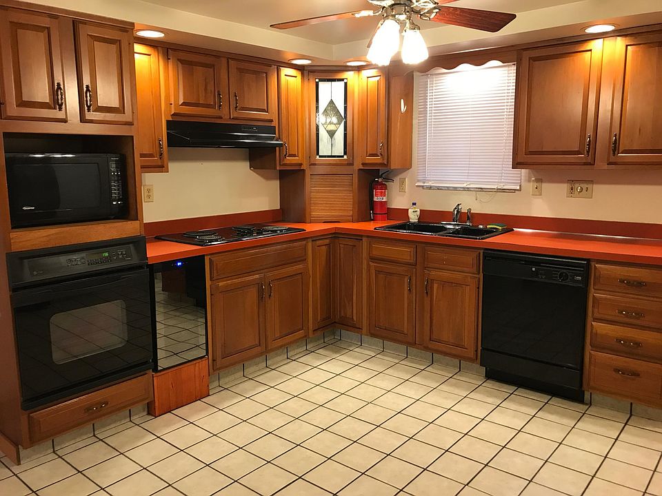 Eat-in Kitchen, with oven, range, microwave, wine cooler, disposal, refrigerator and dishwasher. Plenty of cabinet space and ceiling fan.