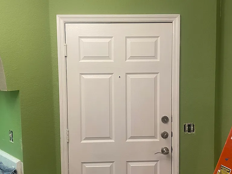 Front door entrance. Freshly painted on May 4th, 2026, to a warm, inviting Mint Green.