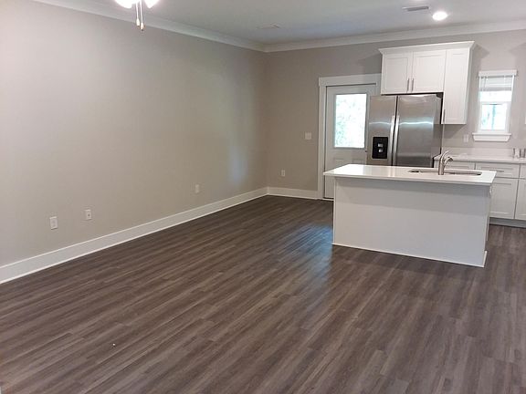 Living room view towards the kitchen.
Back door opens to covered porch \ patio