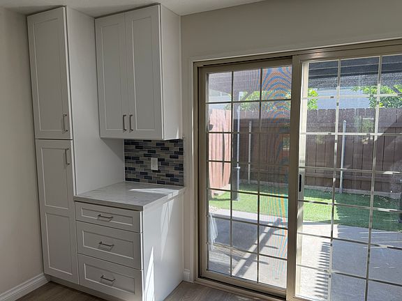 Pantry and coffee bar. Tons of usable storage.