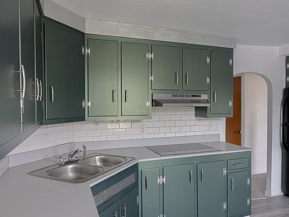 Sleek modern kitchen featuring a brand-new stove-top.