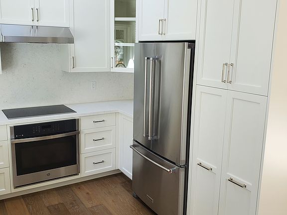 Kitchen with full-size refrigerator