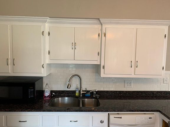 Kitchen backsplash with microwave next to sink. Can locate wherever you'd like.