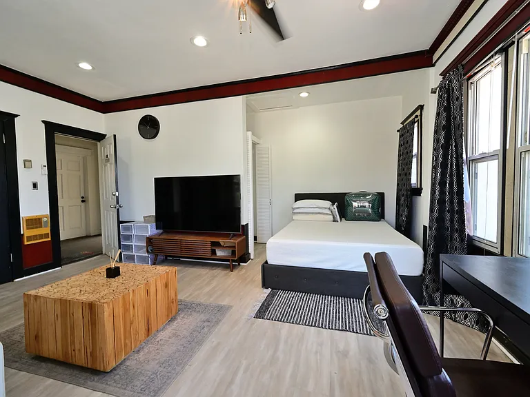 Fully Furnished & Updated LARGE and BRIGHT Studio w/ in-unit laundry + private balcony + parking