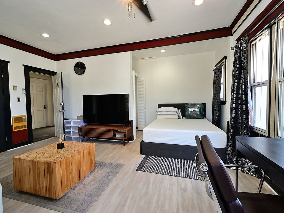 Fully Furnished & Updated LARGE and BRIGHT Studio w/ in-unit laundry + private balcony + parking