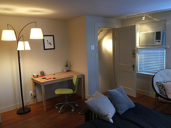 Living room contains one window unit and plenty of natural l