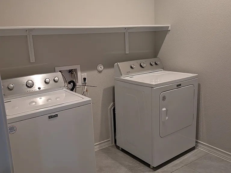 utility room with washer and dryer
