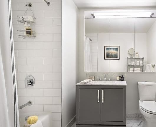 The Arlington's luxurious baths feature Italian marble floors, custom wood cabinetry, and oversized