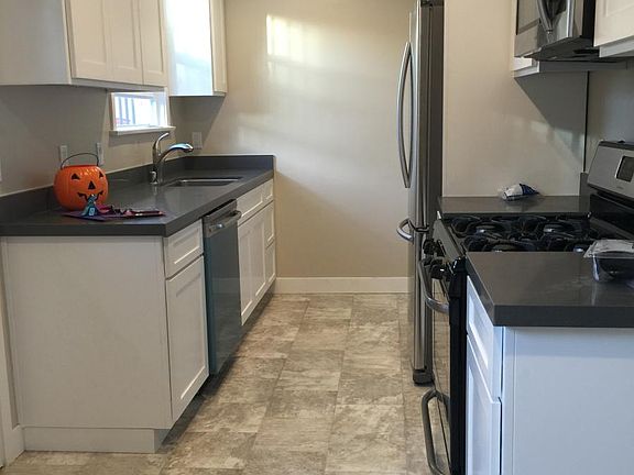 Newly remodeled kitchen with custom cabinets and stainless s