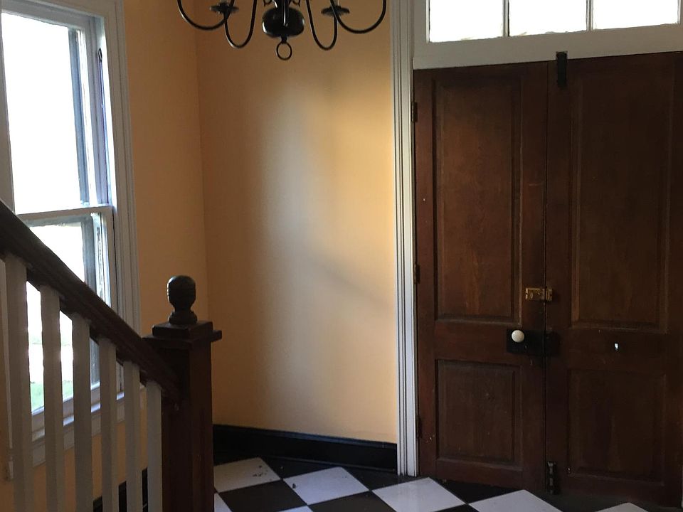 Foyer entrance with stairs leading to Apt B